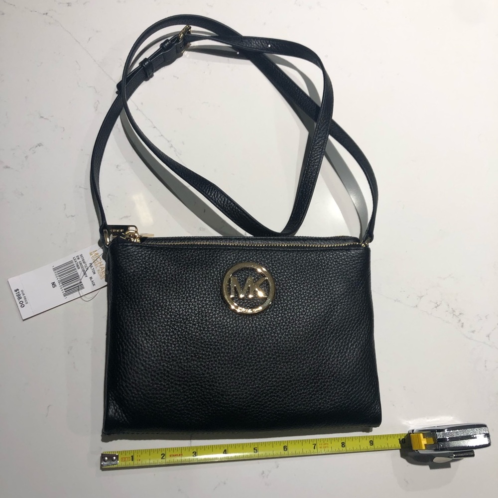 Michael Kors crossbody purse. Brand new. Black with gold detail.